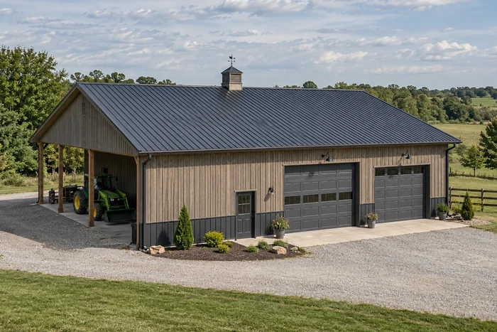Pole barn with a renewed metal roof, ridge cap, and aligned roof panels.